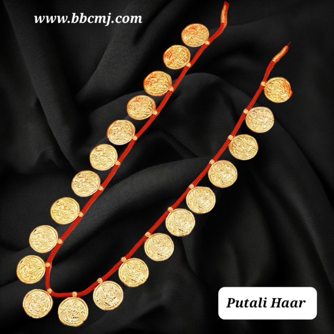 A set of gold-coated putali hair ornaments displayed on a black fabric background, with the brand's website mentioned as www.bbcmj.