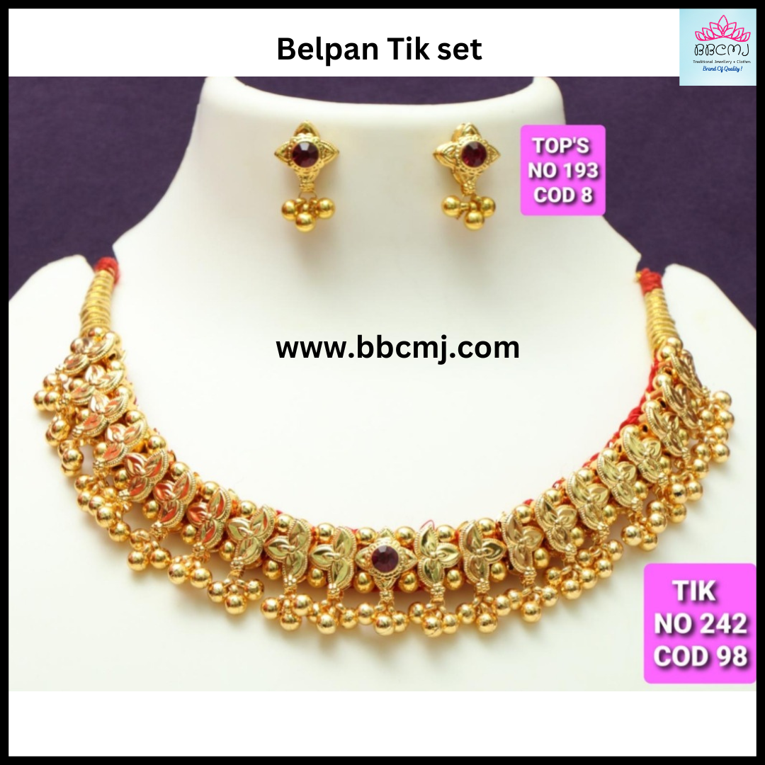 A gold-coated Belpan Tik set with intricate designs and matching earrings.