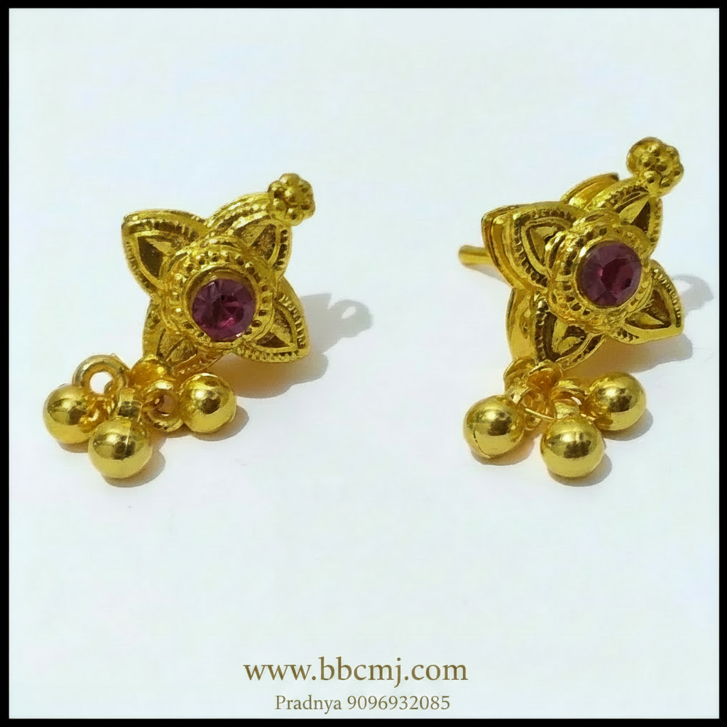 A pair of gold-colored earrings with intricate designs and small bell-like pendants.
