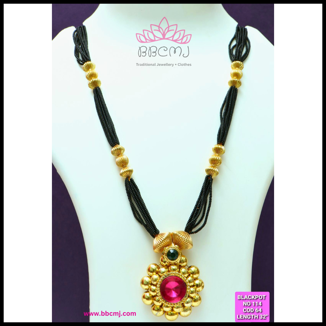 A gold coated mangalsutra necklace with black beads and a multicolor stone pendant, displayed on a mannequin.