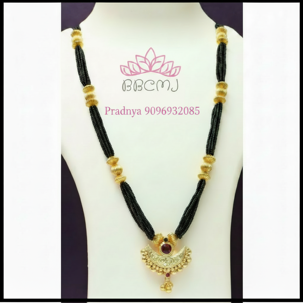 A gold-coated black bead Mangalsutra necklace with a length of 32 inches, featuring a pendant with a red gemstone, displayed on a mannequin.