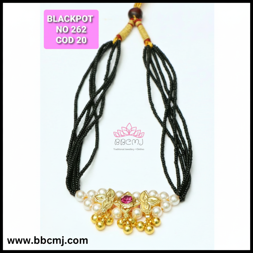 A black mangalsutra necklace with gold-colored accents and pearl-like beads, featuring a floral design on the pendants.