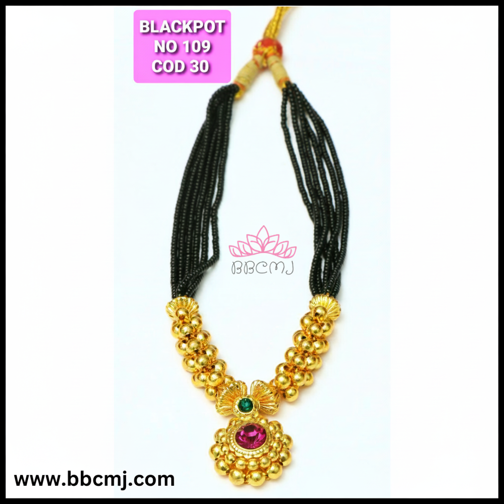 A gold coated black pot short mangalsutra with floral patterns and matching earrings, displayed against a white background.