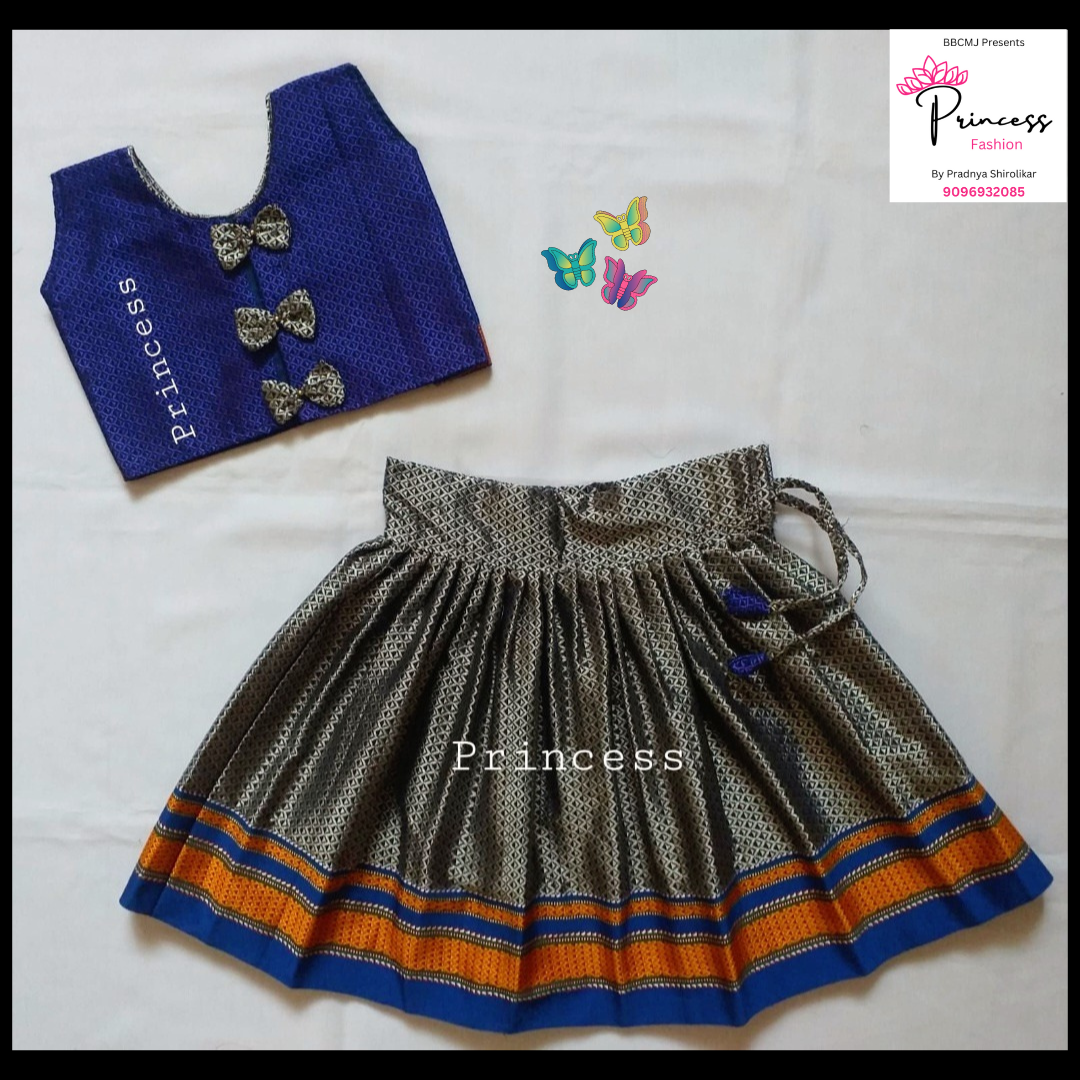 A traditional khun fabric Parkar Polka for babies, featuring a blue and gray color scheme with orange and yellow stripes, displayed with a blue bow and butterfly accessories.